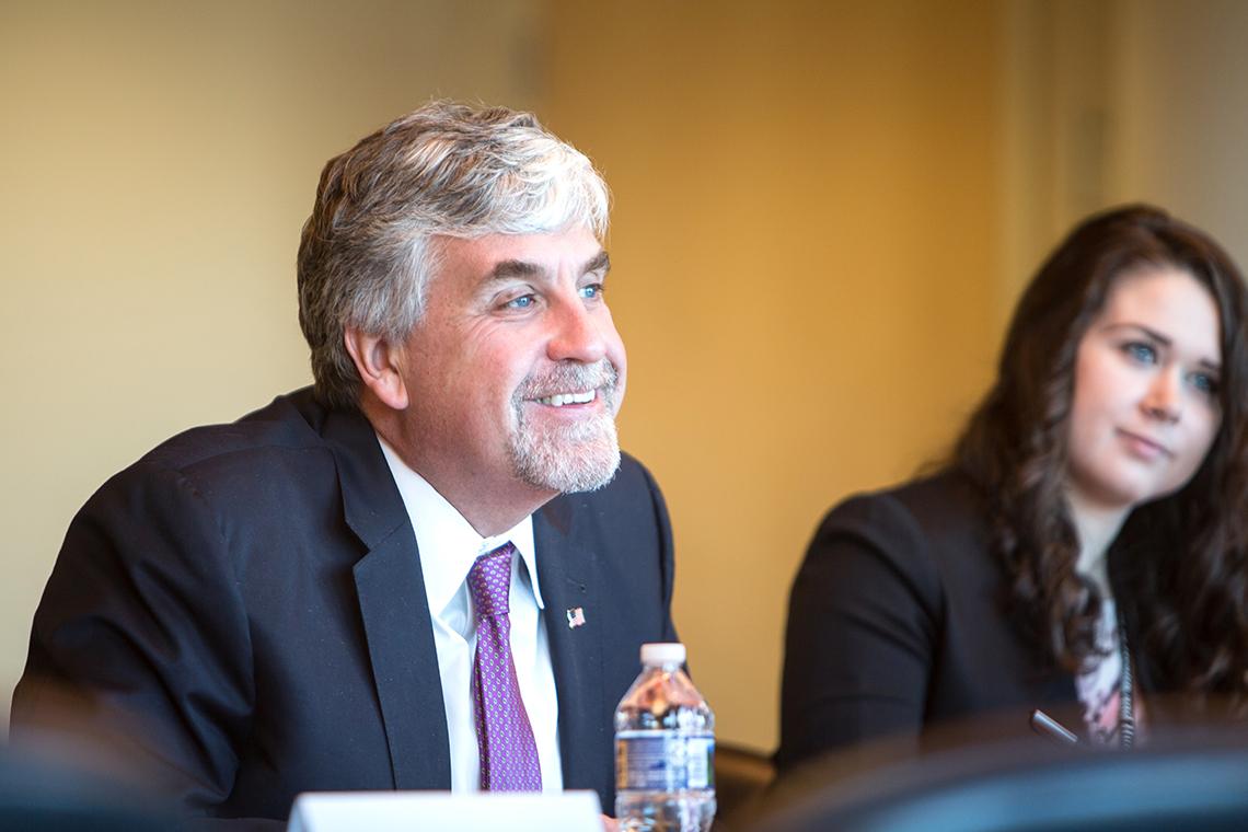 Hargan listens to NIH leaders.