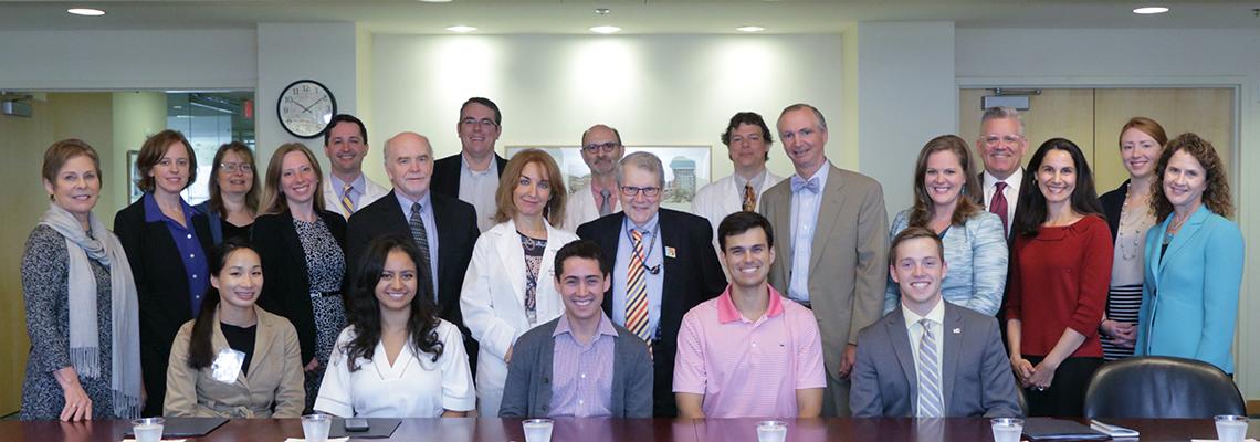Katz and Carter take a group photo with congressional staff, NIAMS Coalition members and NIAMS staff