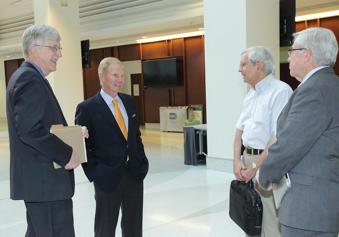 Collins greets Nelson, along with  Hodes and Koroshetz