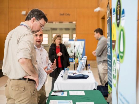 Sebek speaks to a member of the NIH intramural community