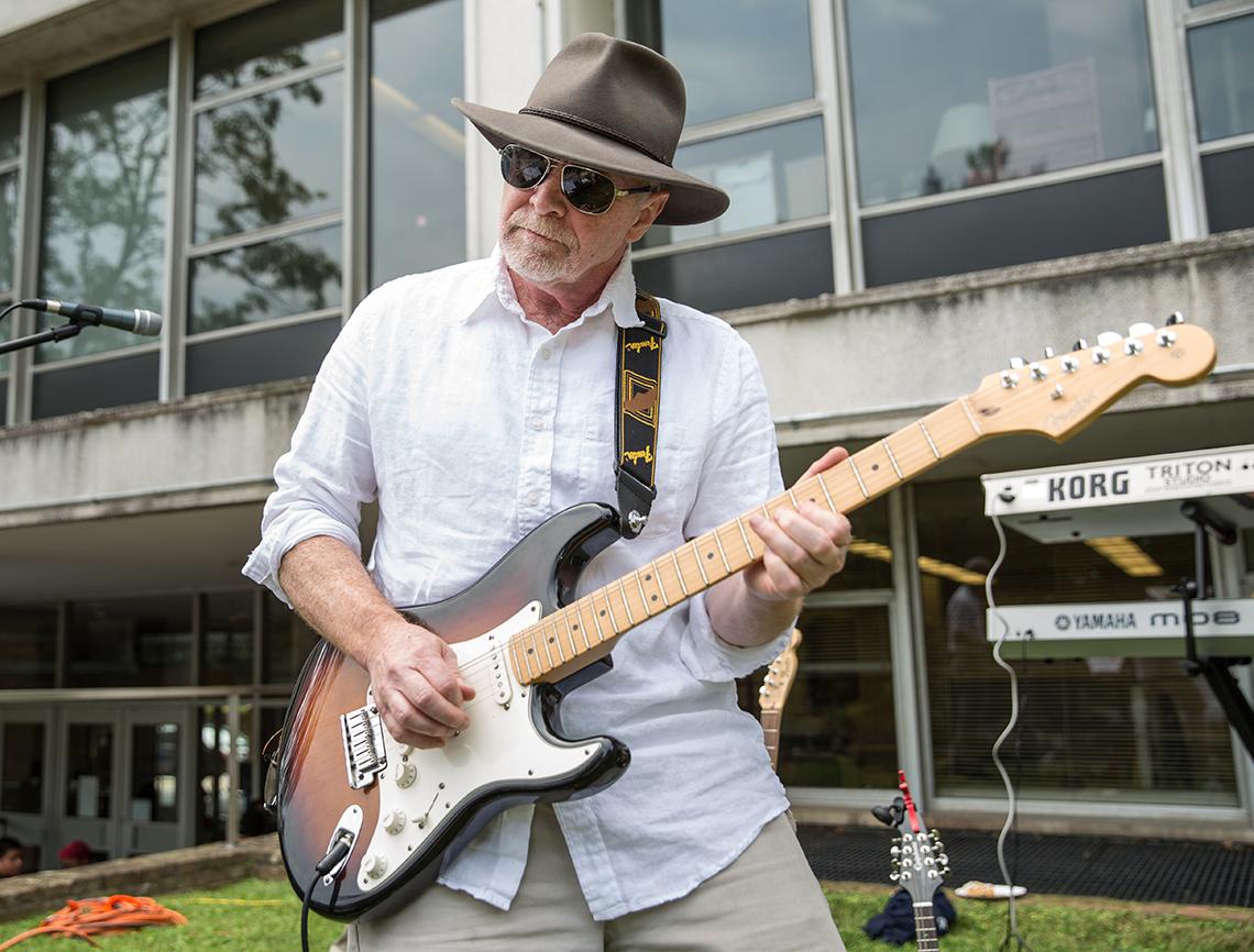 Dr. John O’Shea plays the electric bass.