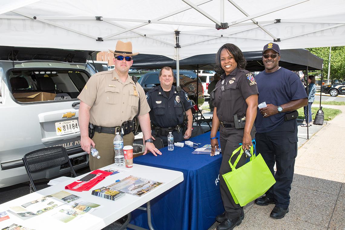 Four officers smile for camera.