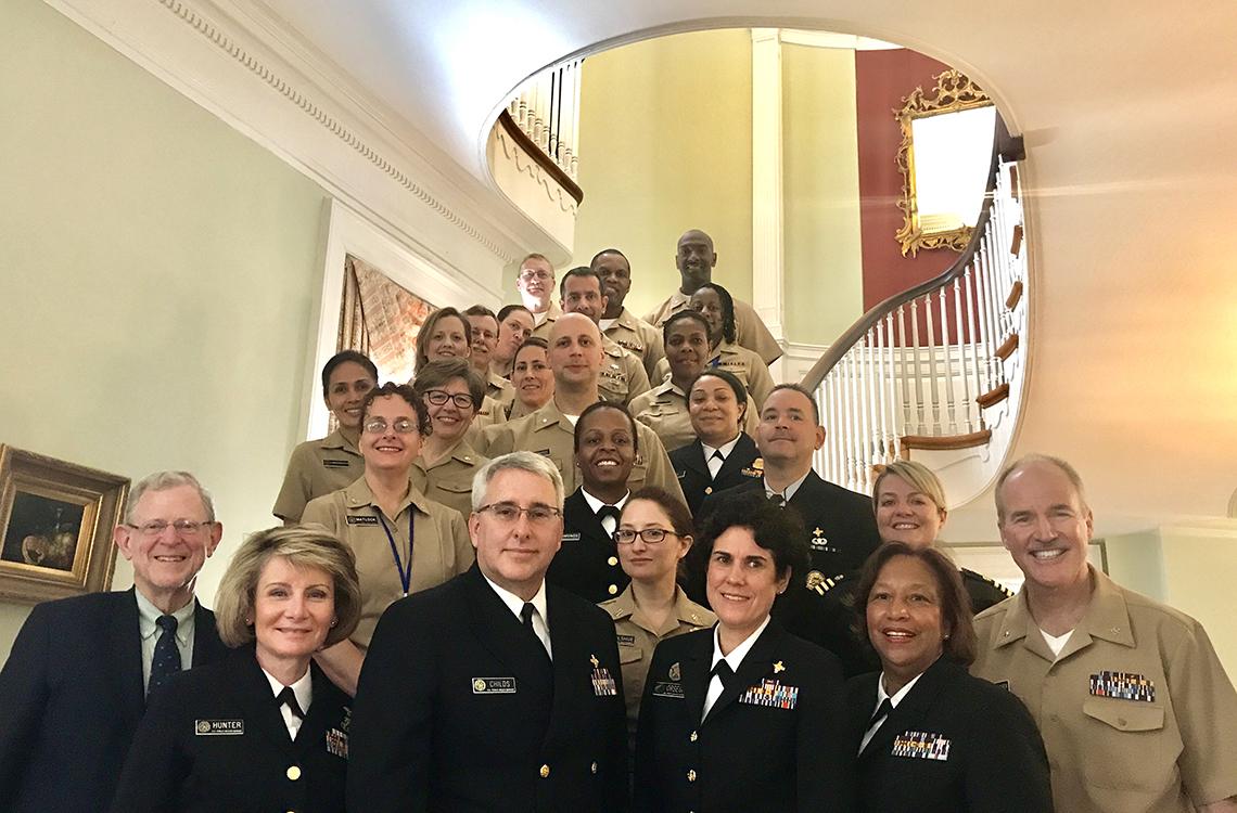 Members of the Commissioned Corps, in uniform, attend all-hands meeting at Stone House.
