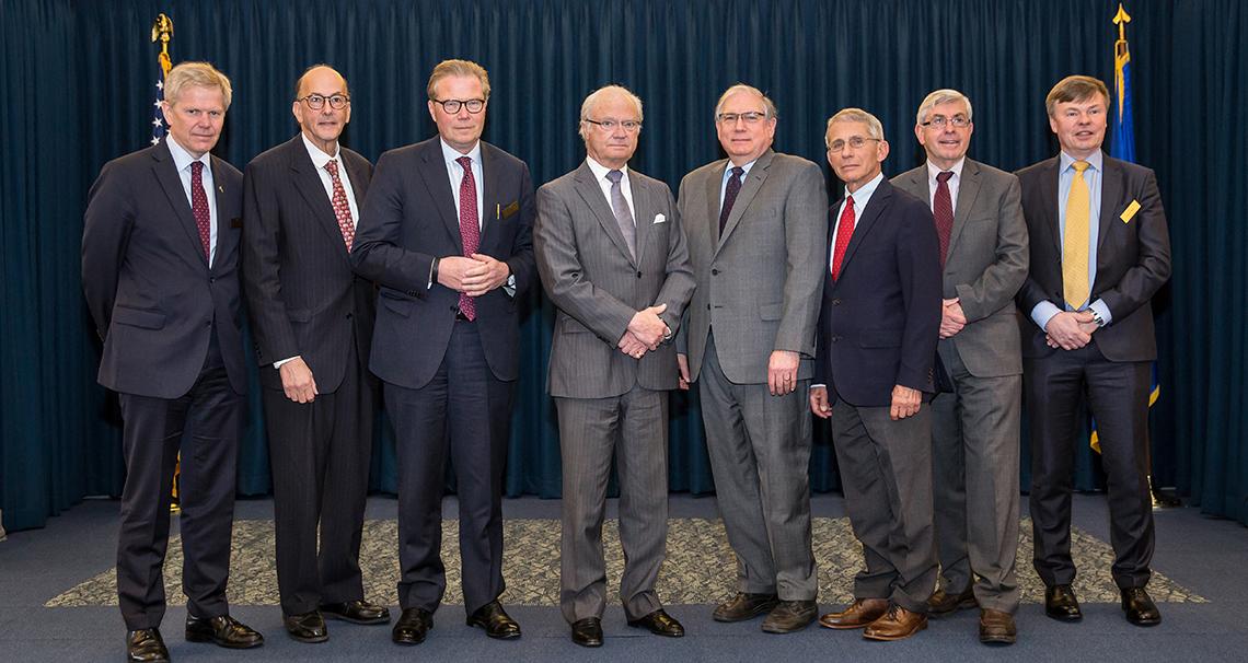 Sweden's King Carl poses with members of his delegation and NIH leadership
