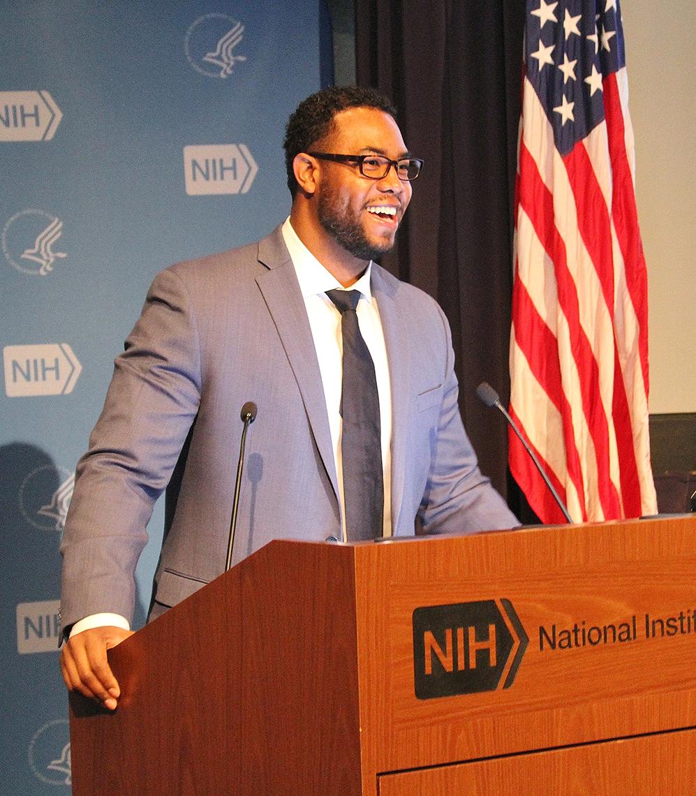 Dr. Robert Walker speaks at a podium