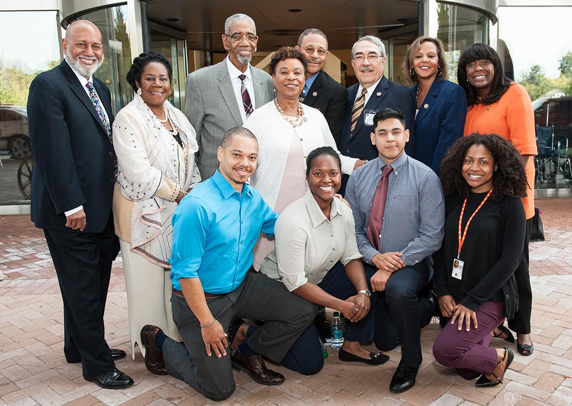Caucus members pose with trainees
