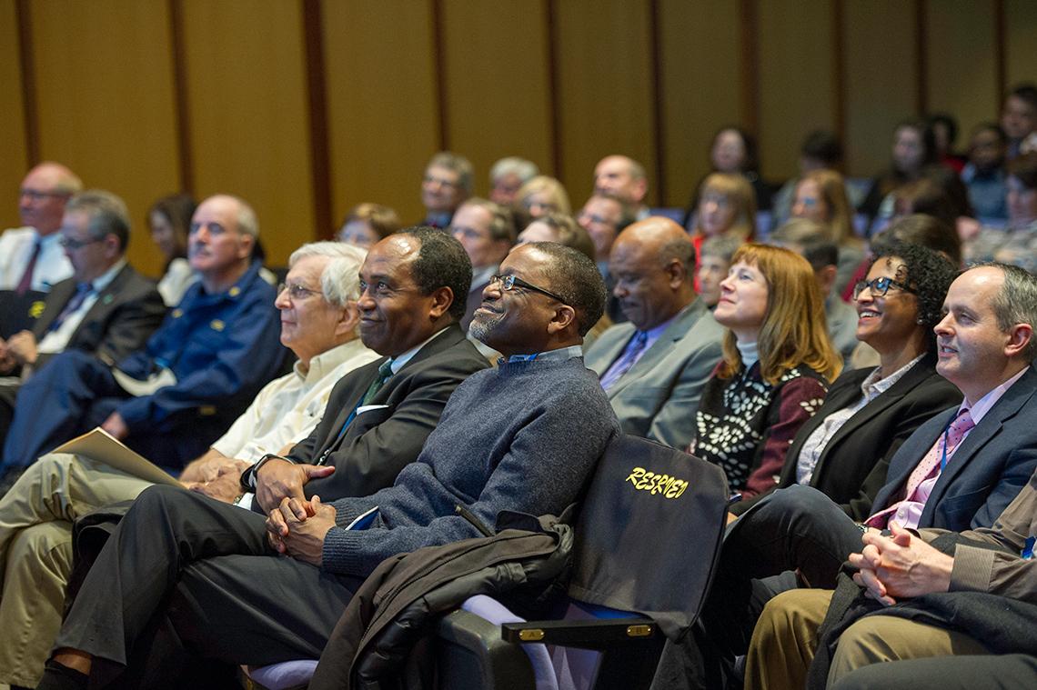 Institute directors and other top leaders take in the presentation.