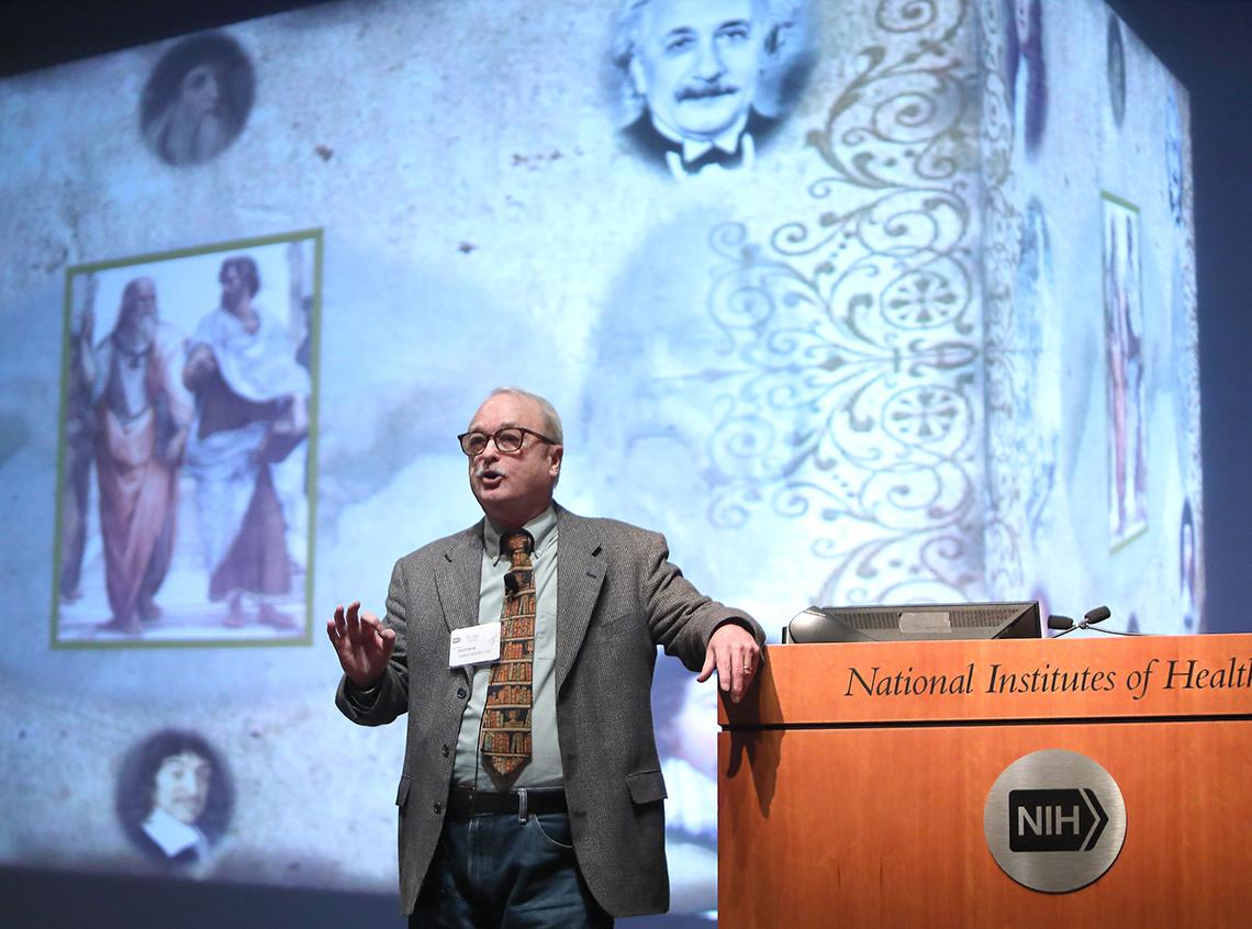 Wide shot of Moreland at the podium