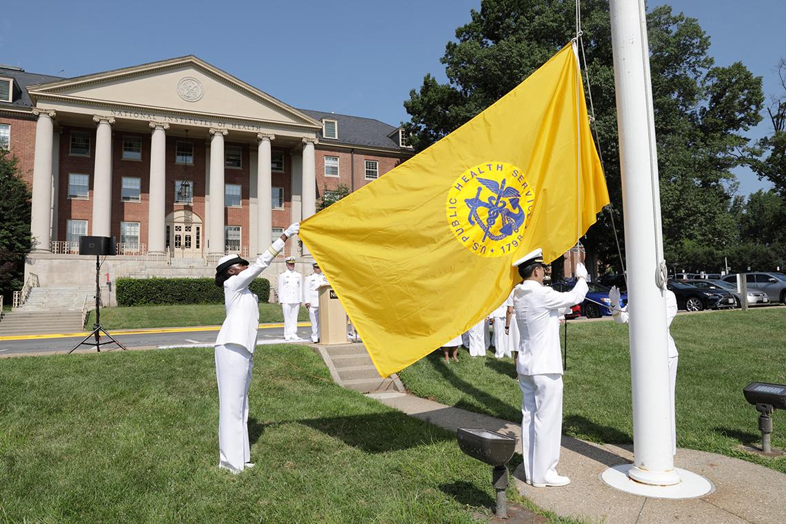 The Public Health Service flag is raised.