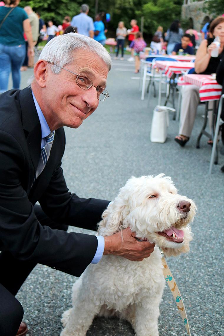 Dr. Anthony Fauci poses with Zilly, the Children's Inn therapy dog.