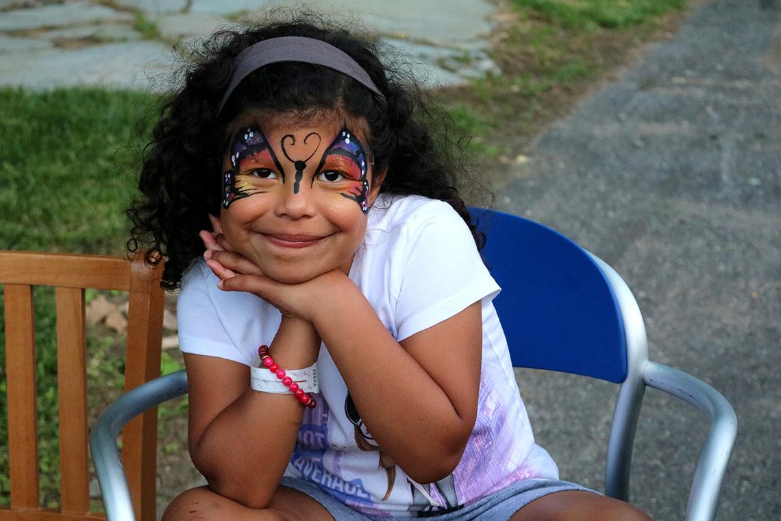 Emma Sotelo of Texas shows off her butterfly face paint.