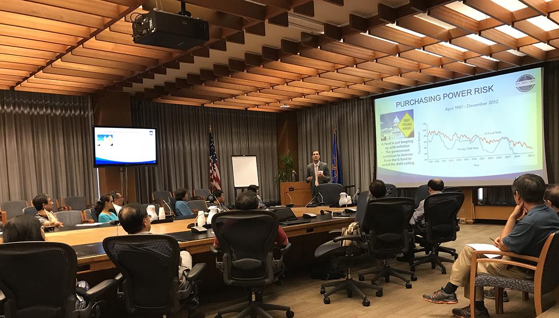 NIH employees listen to a presentation