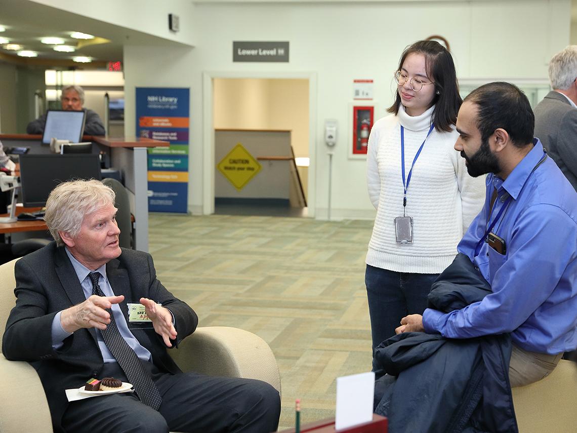 Dr. Michael Young speaks wtih lecture attendees
