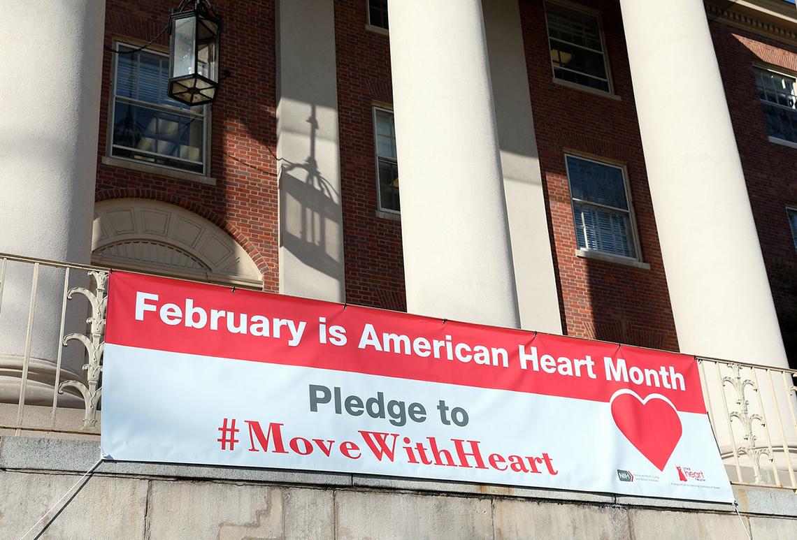 Banner hanging in front of Bldg. 1 reads: Pledge to Move with Heart