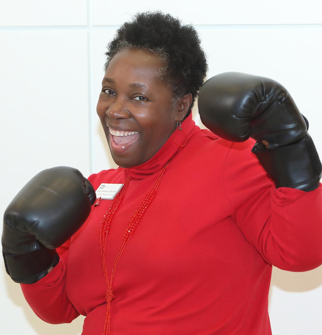 Clinical Center nurse poses in boxing gloves