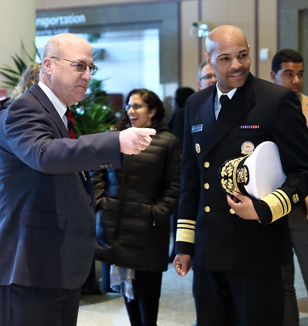Dr. Gilman chats with U.S. surgeon general Dr. Adams in Clinical Center lobby