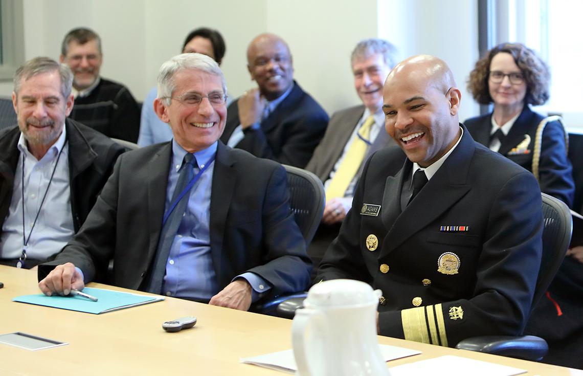 Dr. Fauci and the new surgeon general share a laugh before the briefing