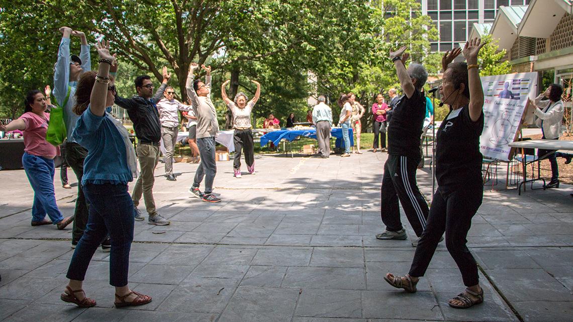 Instructors Hoang-Tam Hilton and Thomas Huppmann teach tai chi basics.