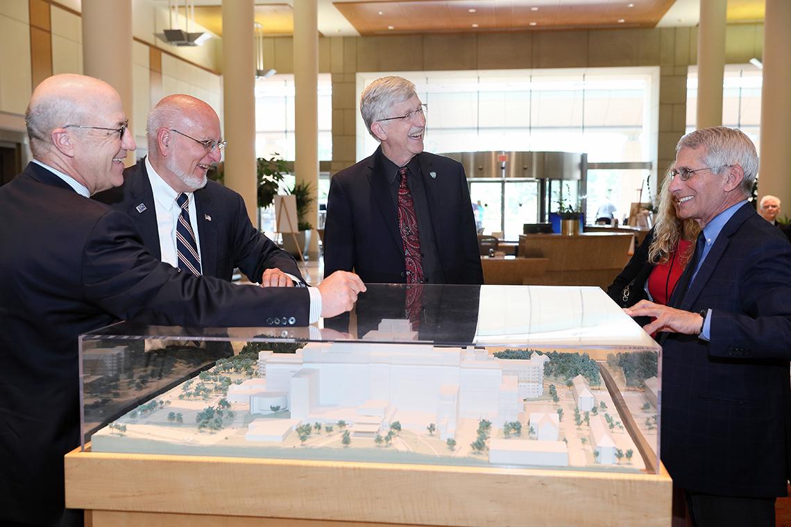 Redfield views the CRC model with Dr. James Gilman, Collins and Fauci.