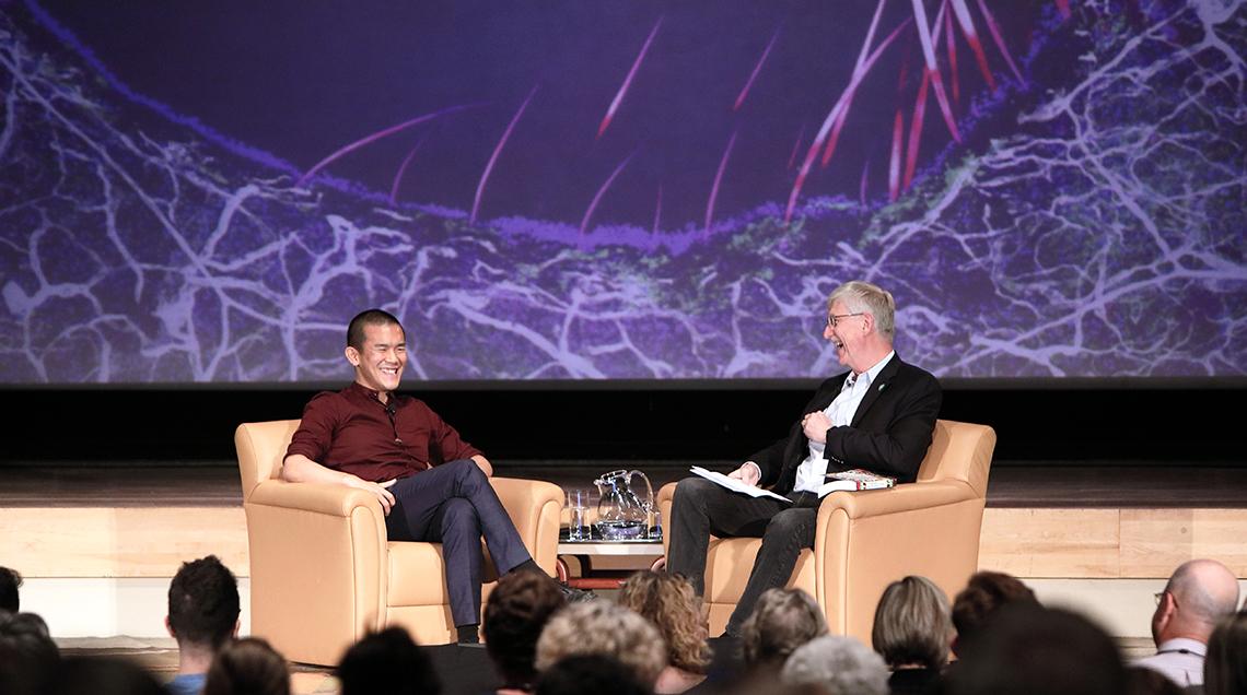 Yong chats onstage with Collins in Masur Auditorium.
