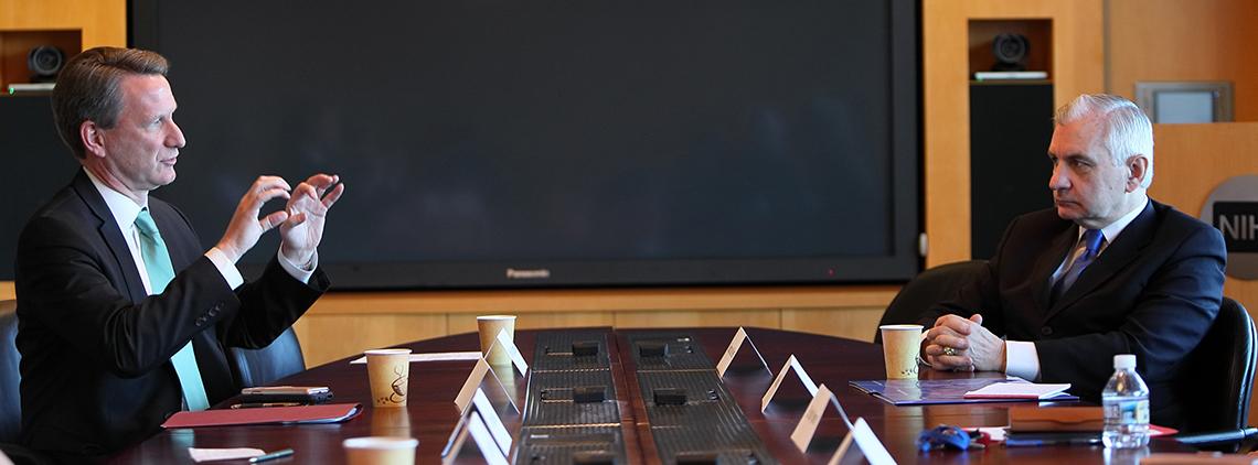 Reed is briefed by NCI director Dr. Ned Sharpless.