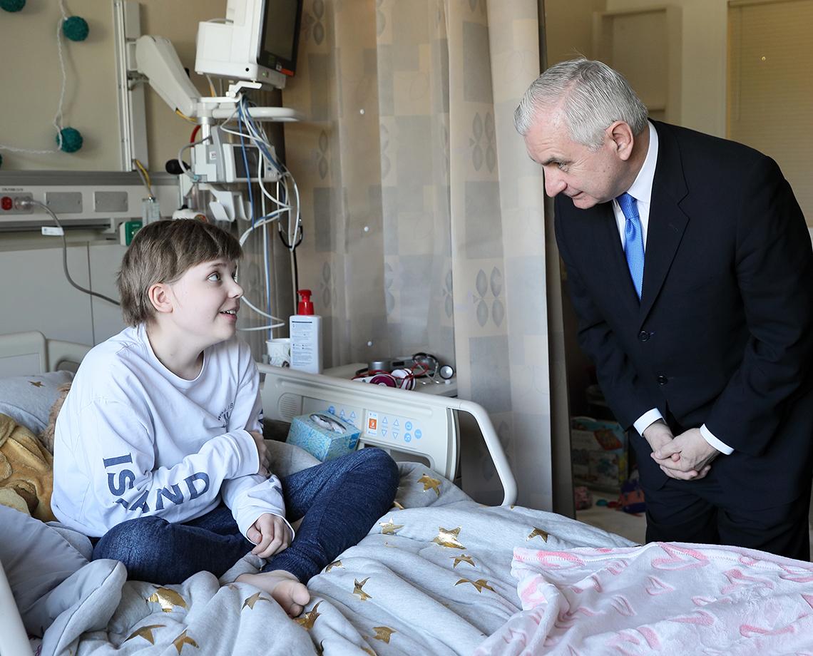 Reed visits with a patient.