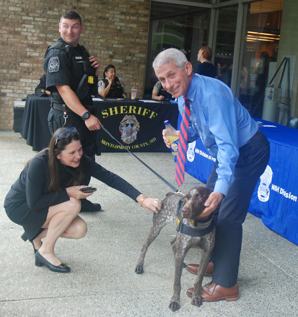 Peter Girgenti of Montgomery County Park Police, with Xena and Dr. Anthony Fauci.
