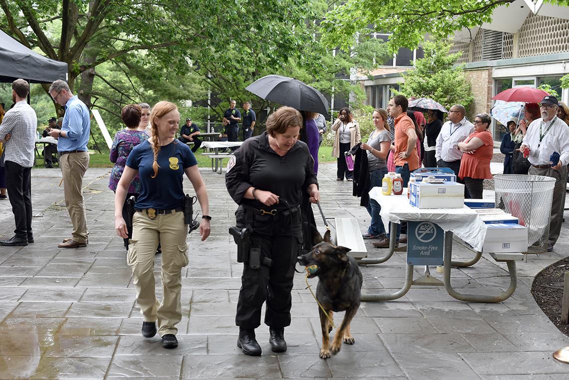 NIH Police Cpl. Christine Fedorisko and K9 Deputy Casey Meiklejohn, with Odie.
