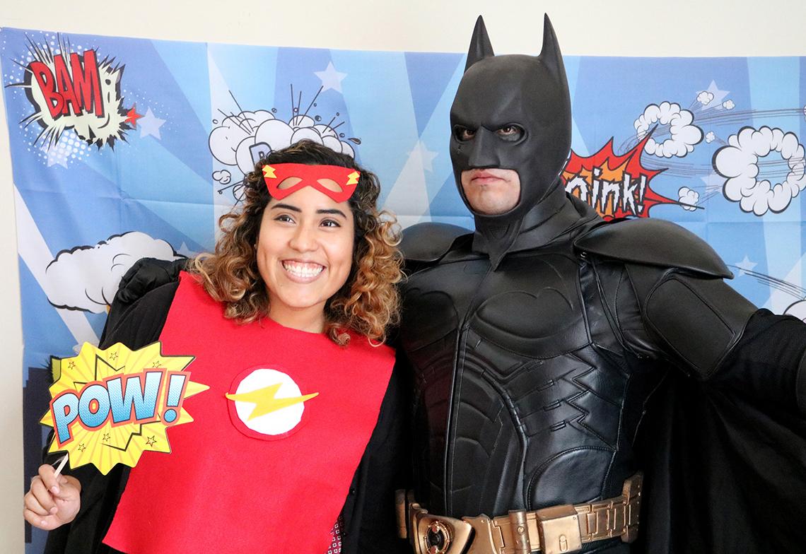 Lidia Rosas smiles with Batman.
