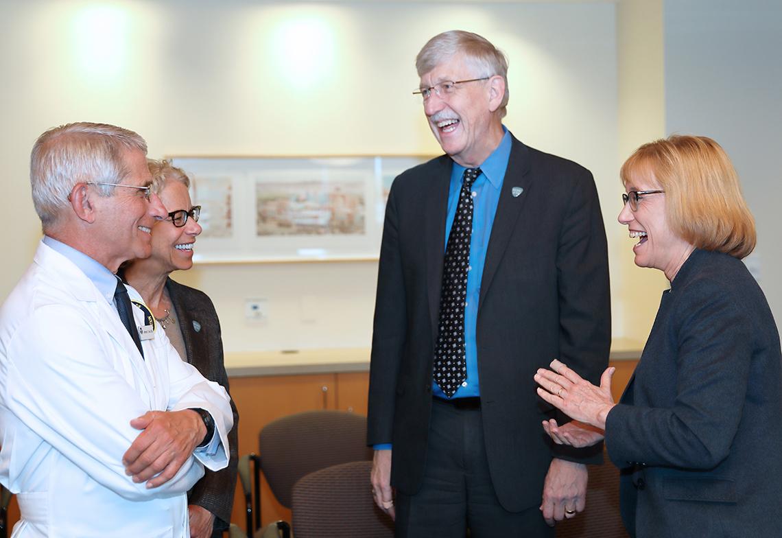 Hassan enjoys a laugh with Fauci, Bianchi and Collins.