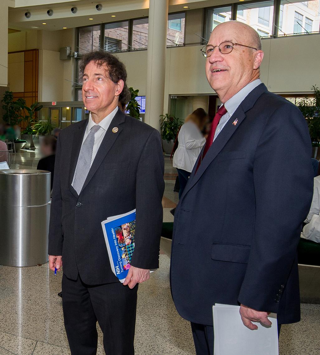 Raskin takes in the hospital atrium with Dr. James Gilman.