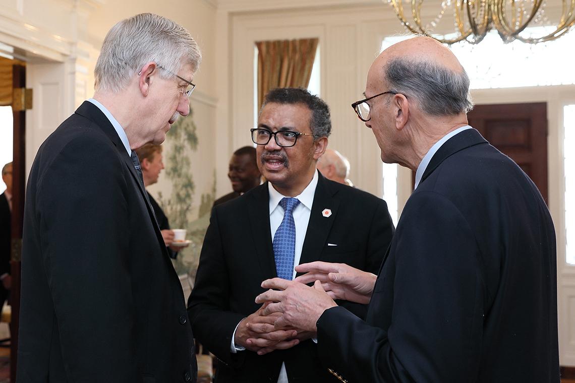 Tedros chats with Dr. Francis Collins and Dr. Roger Glass.