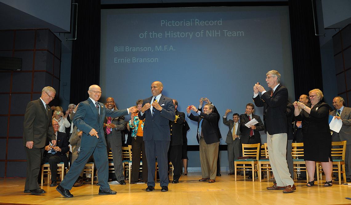 Ernie and Bill Branson accept an award