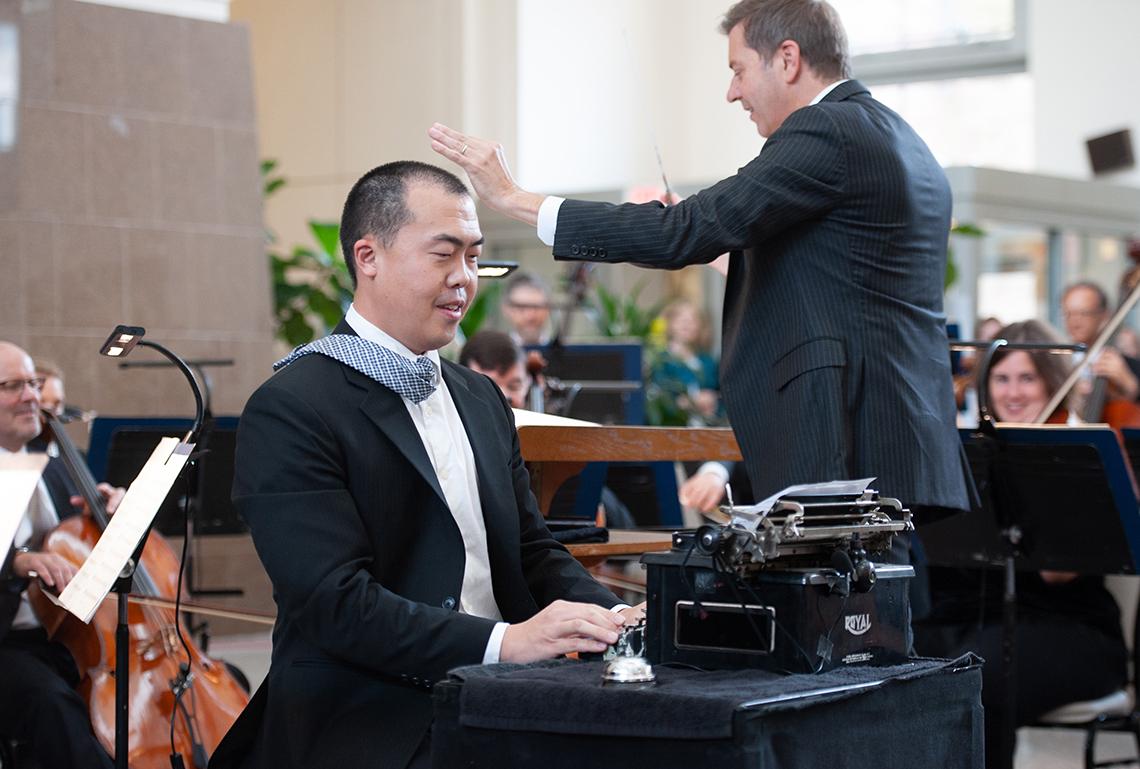 Eric Shin solos on typewriter as Steven Reineke leads the orchestra.