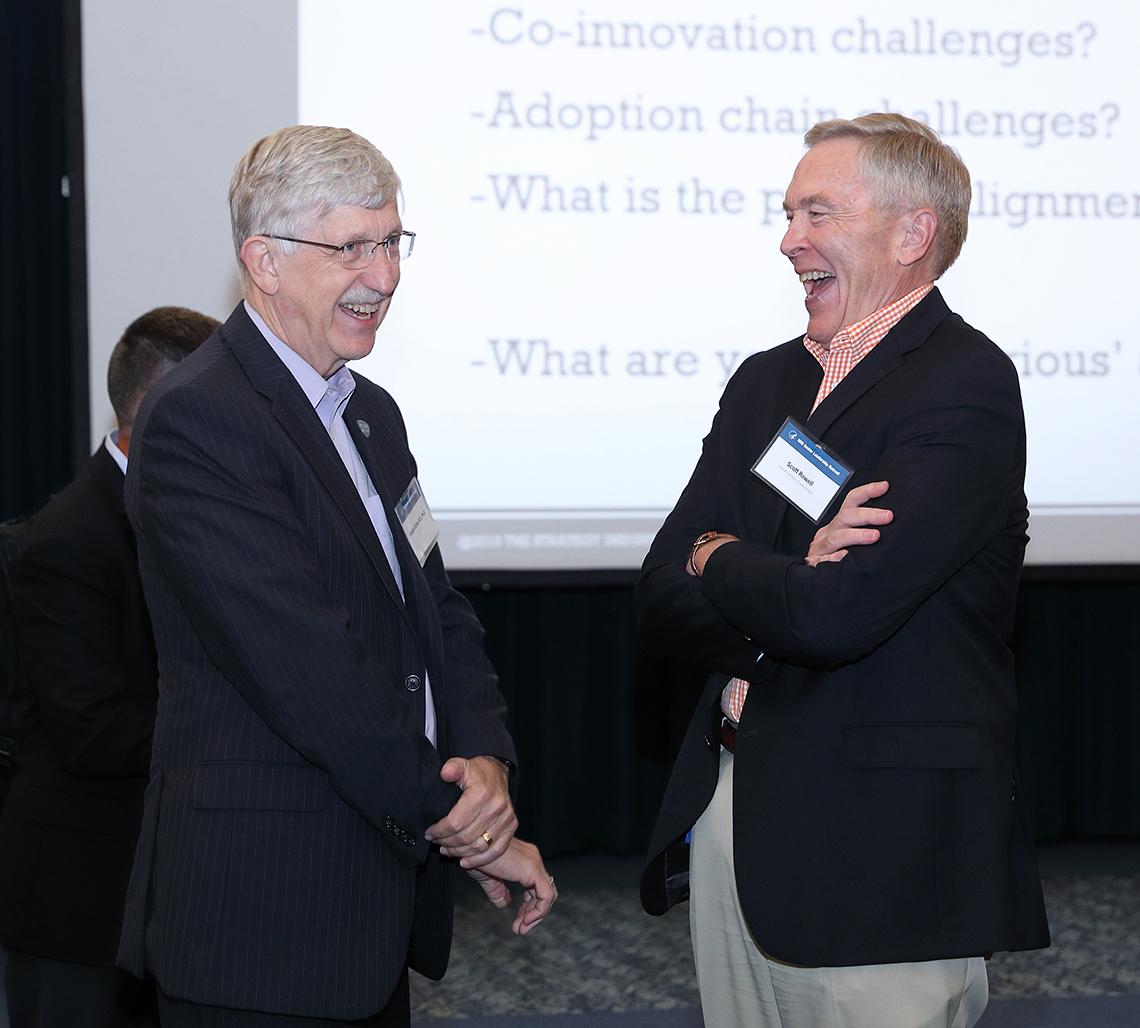 Dr. Francis Collins shares a light moment with Scott Rowell.