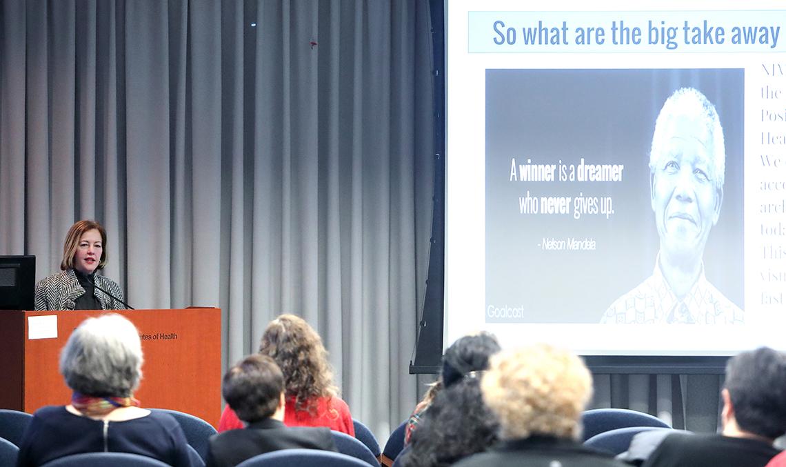 The audience looks on as Alegría speaks