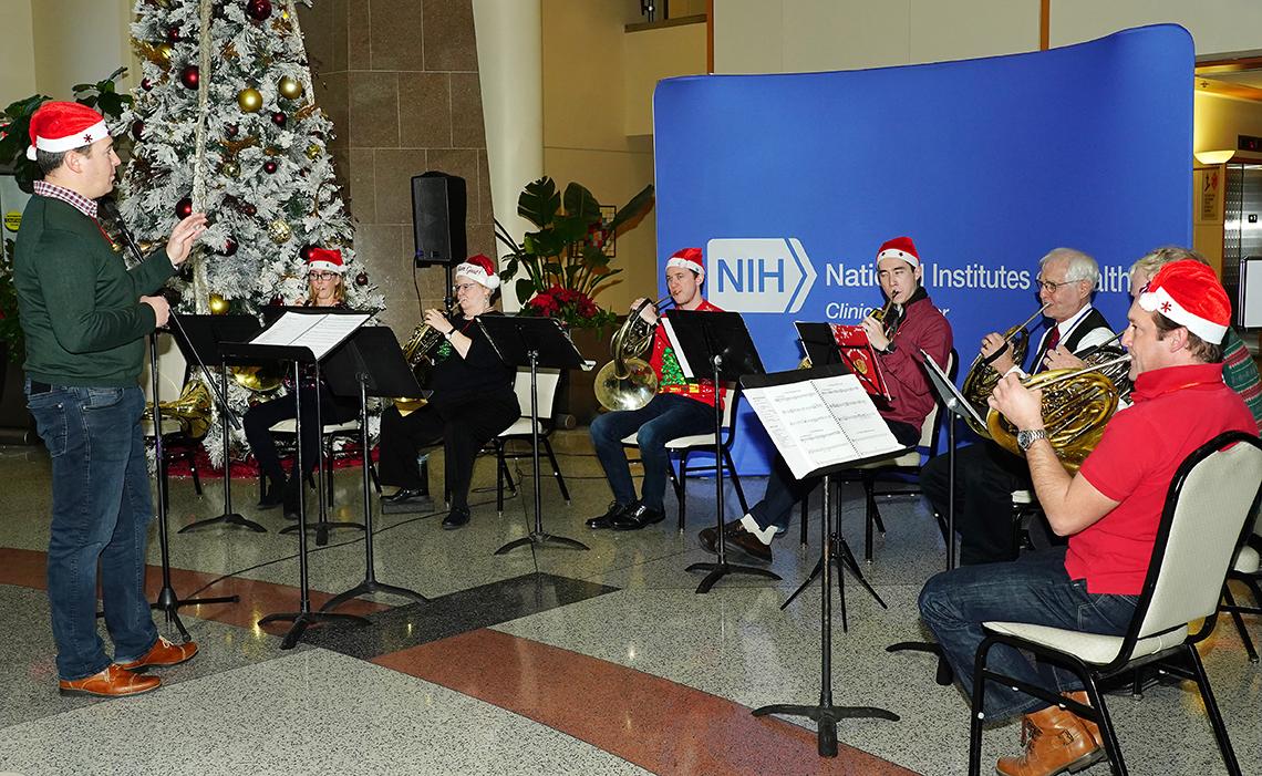 NSO horn ensemble performs at holiday party.