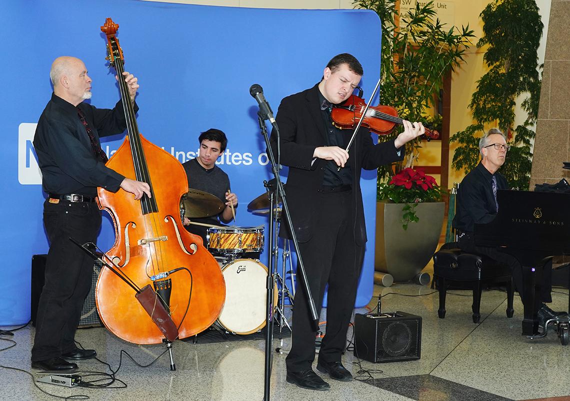 Jazz musicians play at holiday party