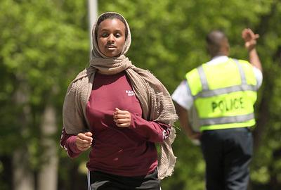 Woman wearing hijab runs