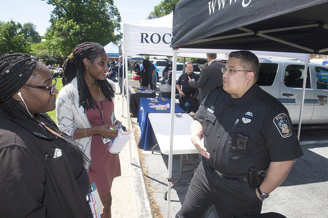 Policeman from Gaithersburg greets picnic guests.