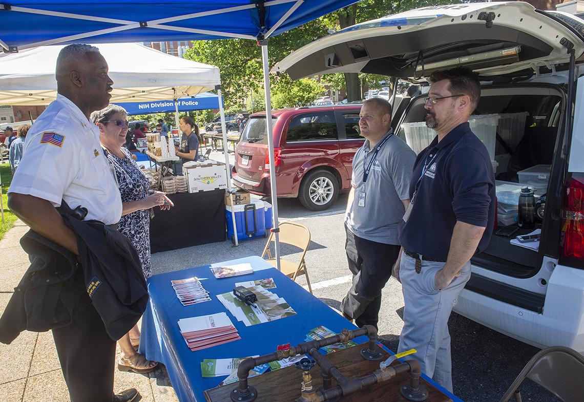 Police man an information table.