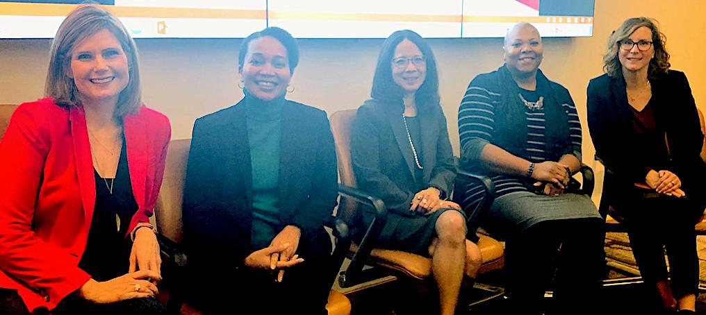 Five women leader panelists seated, smiling at camera