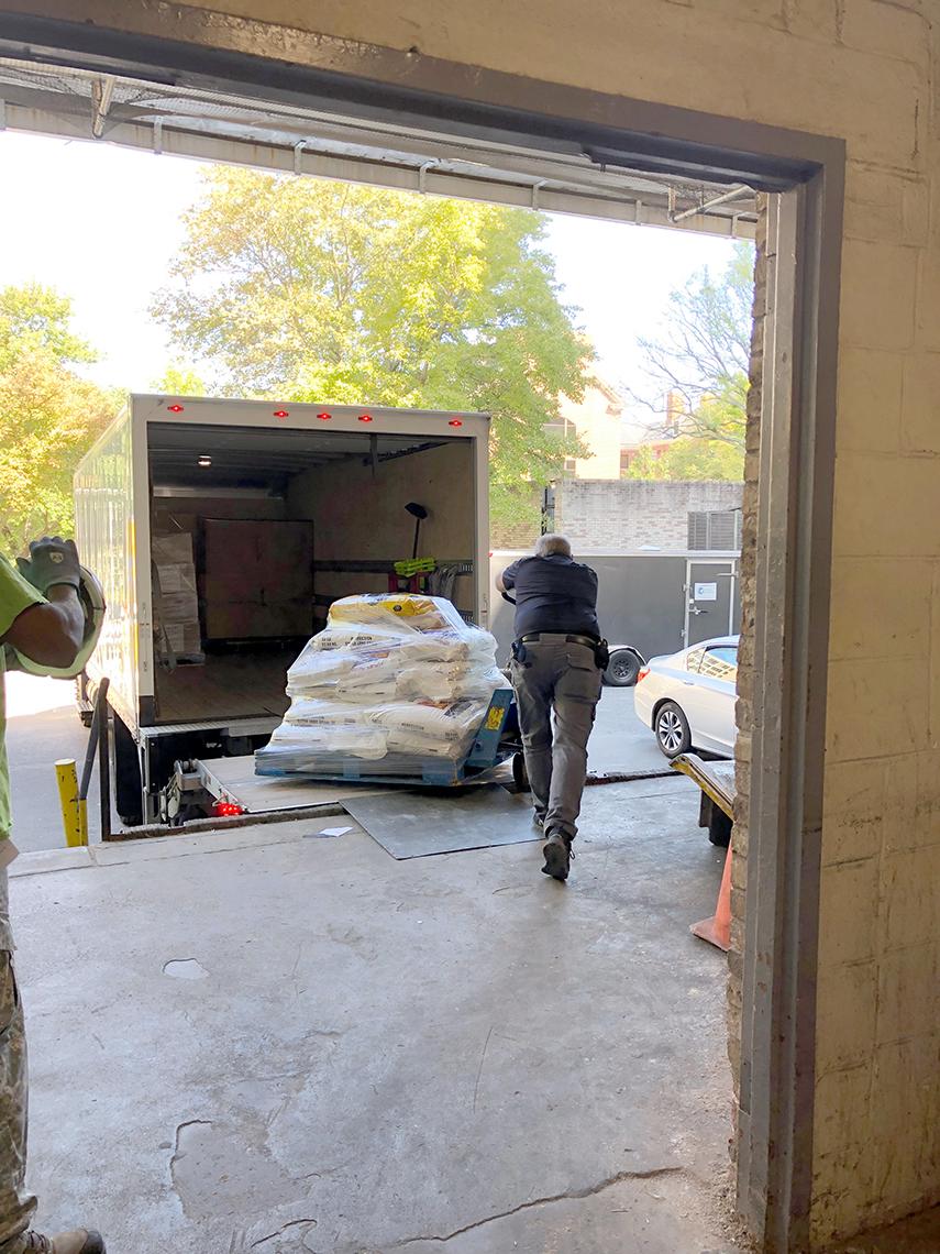 Man works at loading dock.
