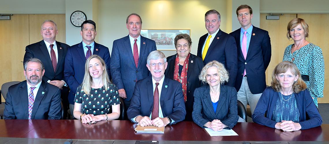 Members of Congress and staff from a working group on addiction pose for a group shot.