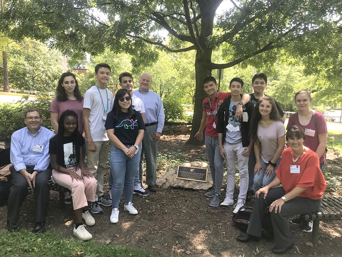 Young science writers gather outdoors at NIH.