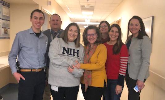 Murphy poses with the NHGRI clinical team in the Clinical Center.