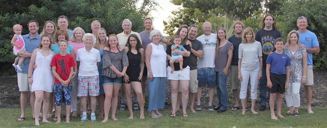 Large group photo of more than 20 people of various ages