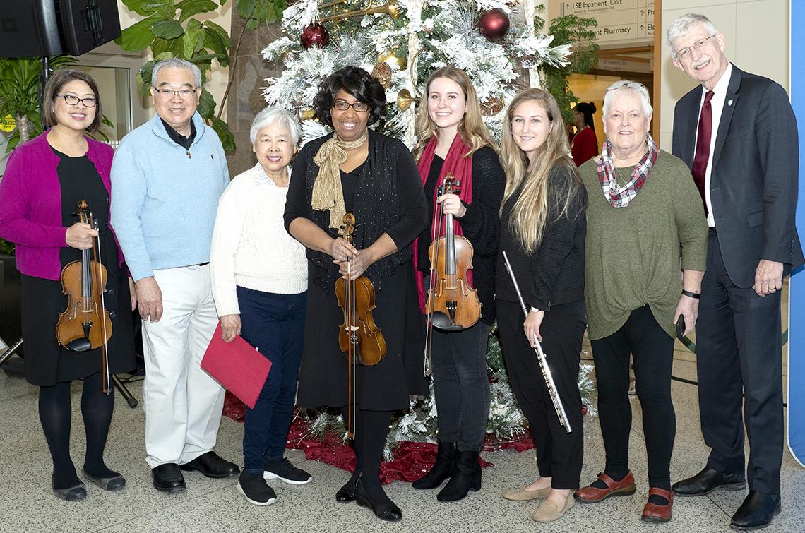 Singing group poses with NIH director.
