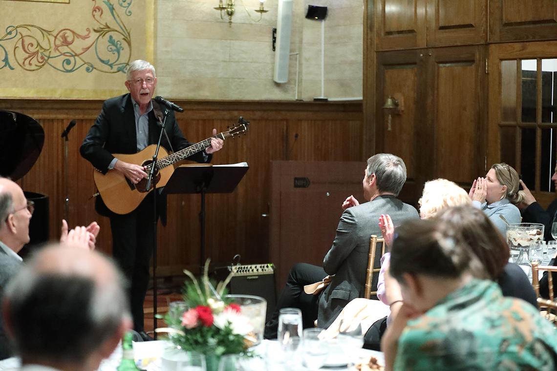 Collins plays the guitar