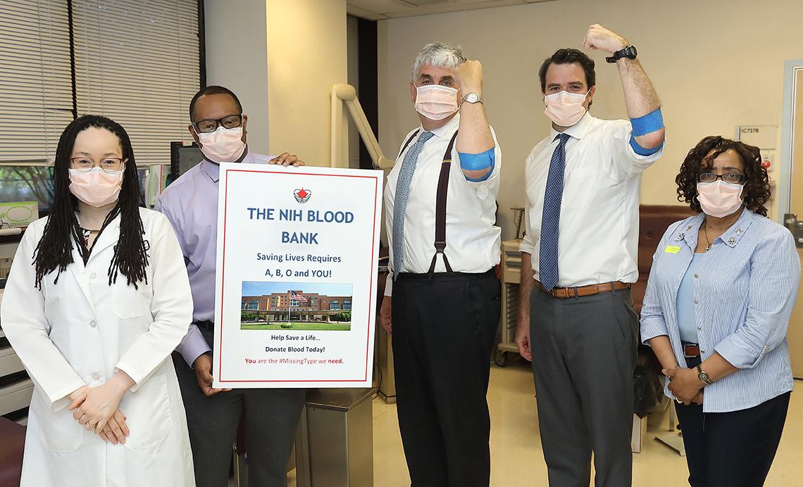 Hargan and his chief of staff stand strong for blood donation.